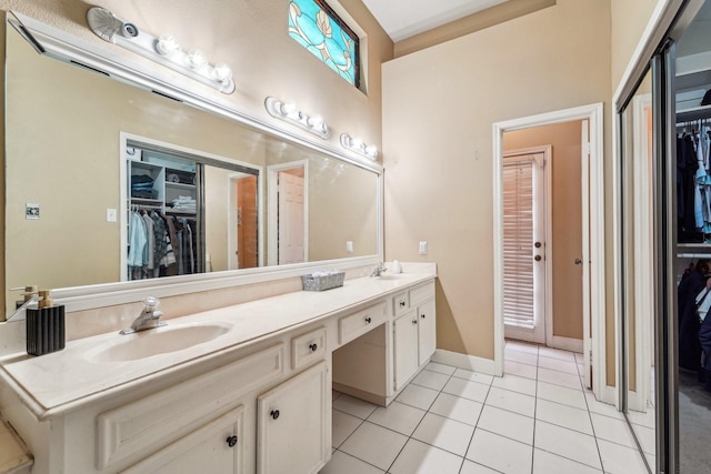 bathroom with vanity and tile patterned floors