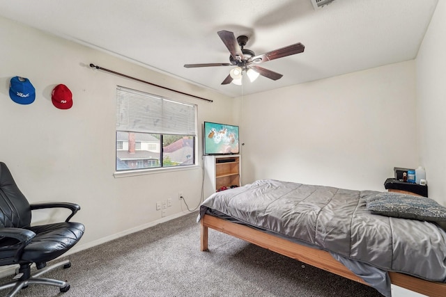 bedroom featuring ceiling fan and carpet