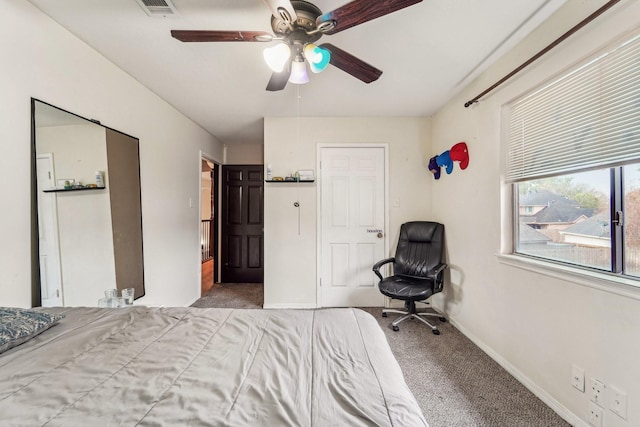 bedroom with ceiling fan and carpet floors