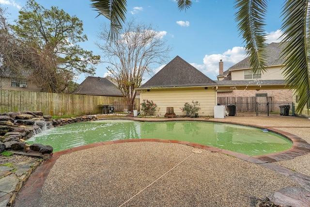 view of pool with a patio area and central AC