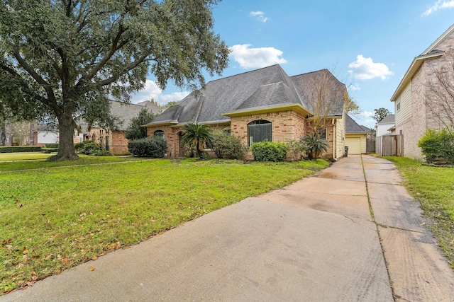 view of front of house with a front lawn and a garage