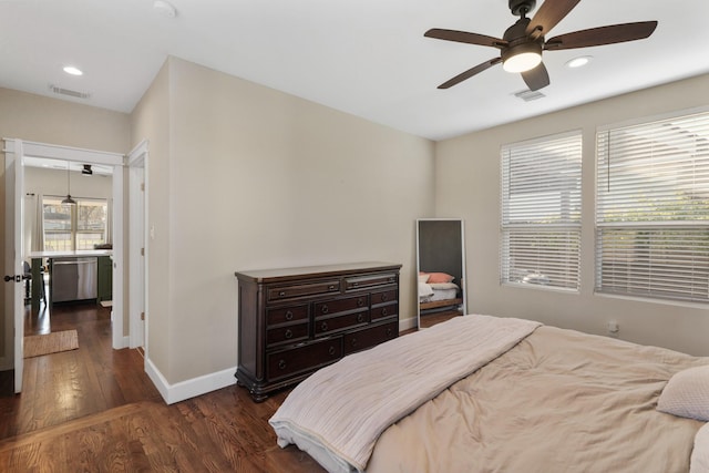 bedroom featuring ceiling fan and dark hardwood / wood-style floors