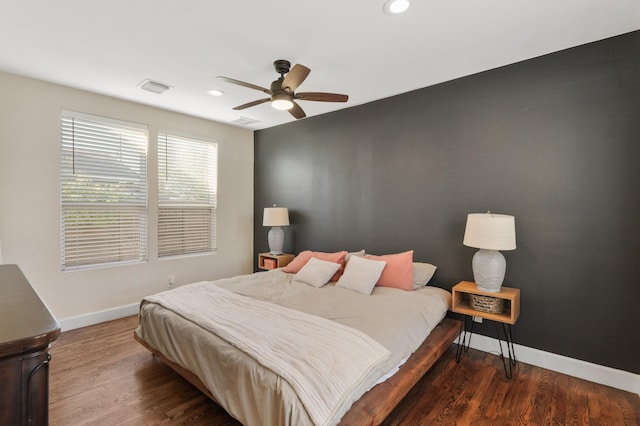 bedroom featuring ceiling fan and dark wood-type flooring