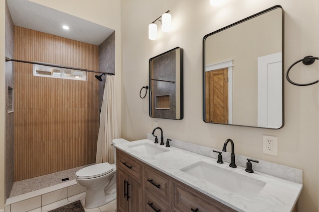 bathroom featuring tile patterned floors, walk in shower, toilet, and vanity