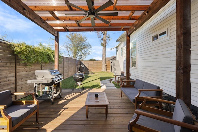 deck with ceiling fan, an outdoor hangout area, and area for grilling