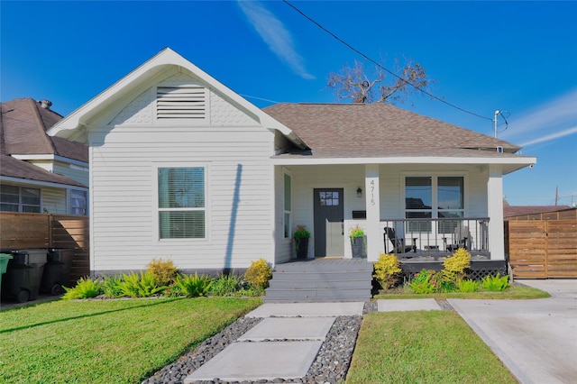 bungalow-style house featuring a front lawn and a porch