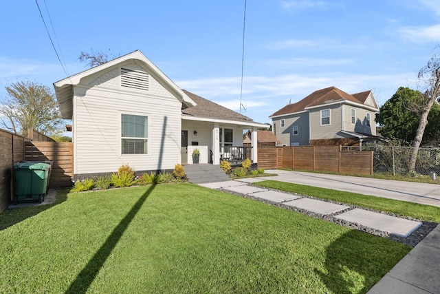 bungalow featuring a porch and a front yard