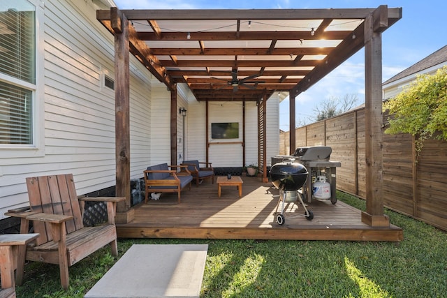 wooden terrace with a grill and an outdoor living space