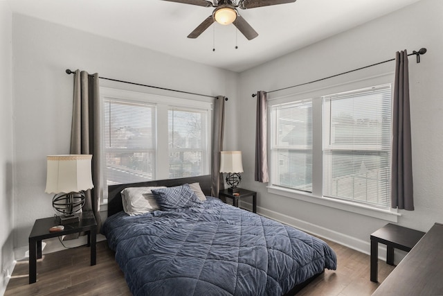 bedroom with ceiling fan and hardwood / wood-style floors