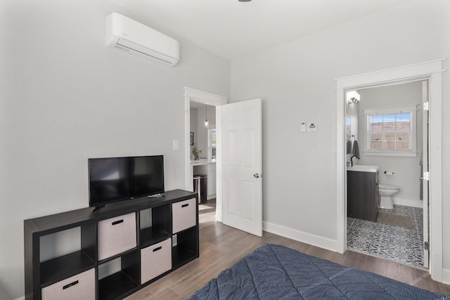 bedroom featuring dark wood-type flooring, an AC wall unit, and sink