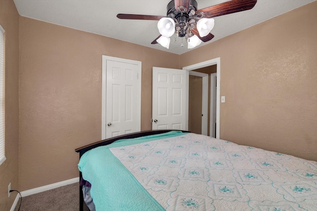 bedroom with ceiling fan and carpet