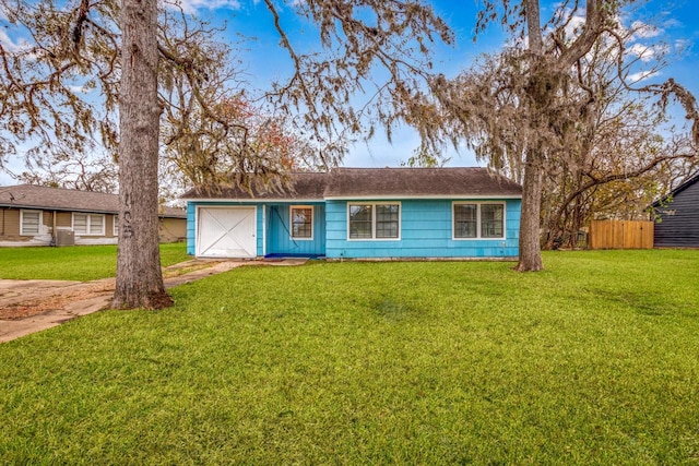 ranch-style house with a garage and a front yard