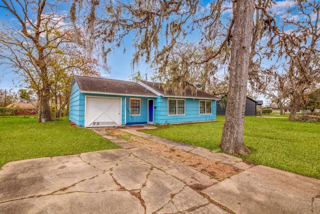 ranch-style home with a front yard and a garage