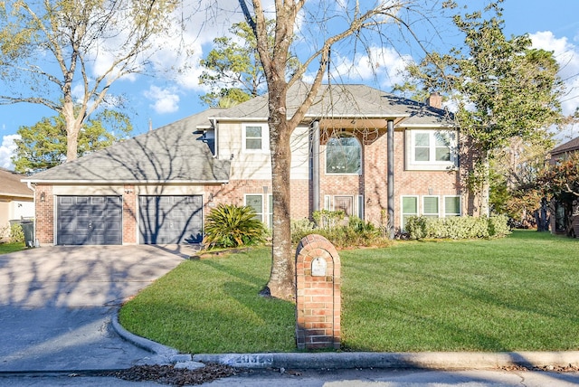 view of front of house featuring a garage and a front yard