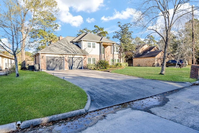 view of property with a front lawn, central air condition unit, and a garage