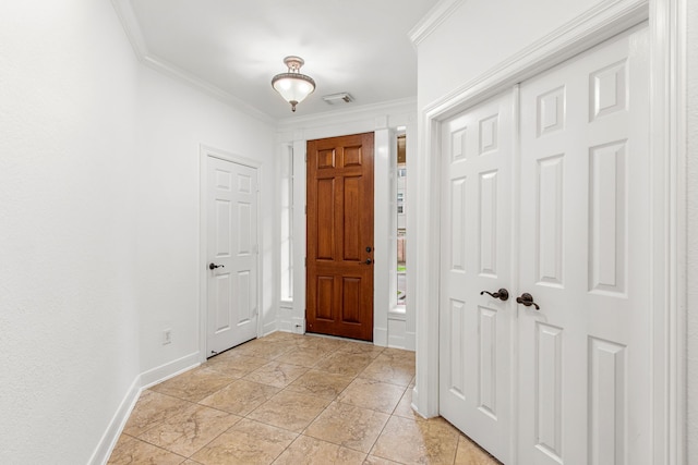 entryway featuring ornamental molding