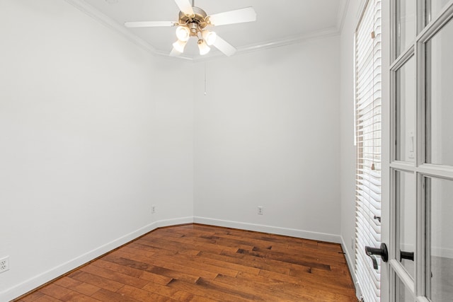 spare room featuring ceiling fan, crown molding, and wood-type flooring