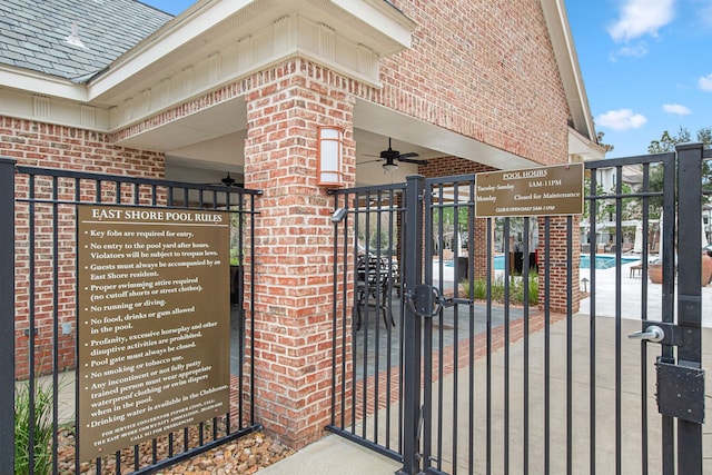 view of gate featuring ceiling fan