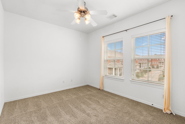 carpeted empty room with ceiling fan