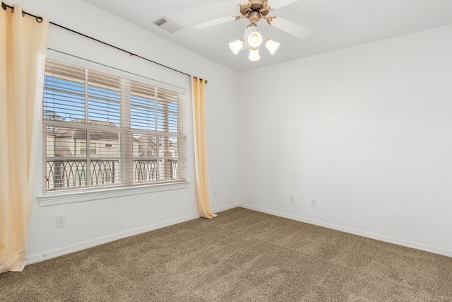 carpeted empty room with ceiling fan