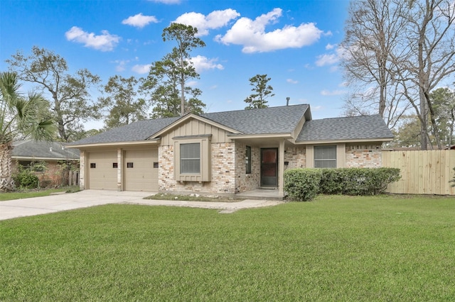 view of front of house with a front yard and a garage