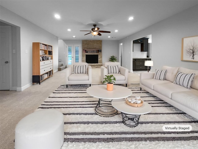 carpeted living room featuring ceiling fan