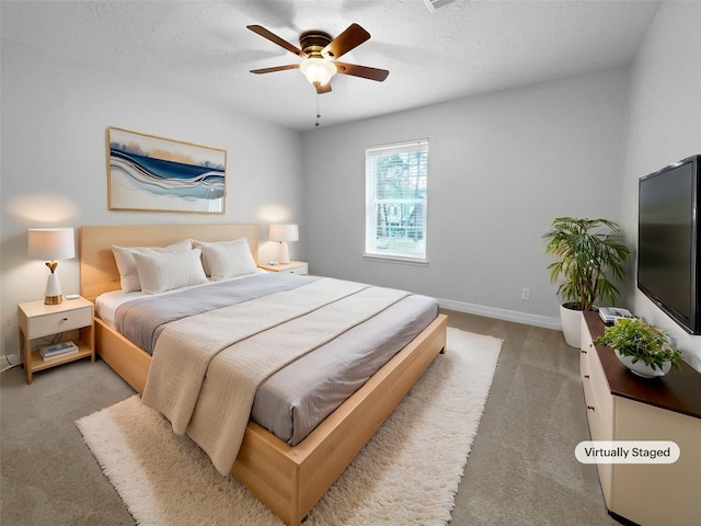 bedroom with ceiling fan and light colored carpet