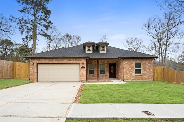 view of front of home with a garage and a front yard