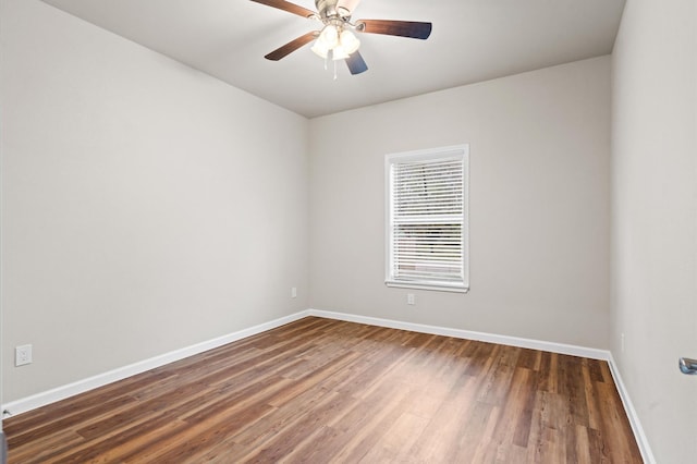 unfurnished room featuring ceiling fan and dark hardwood / wood-style floors