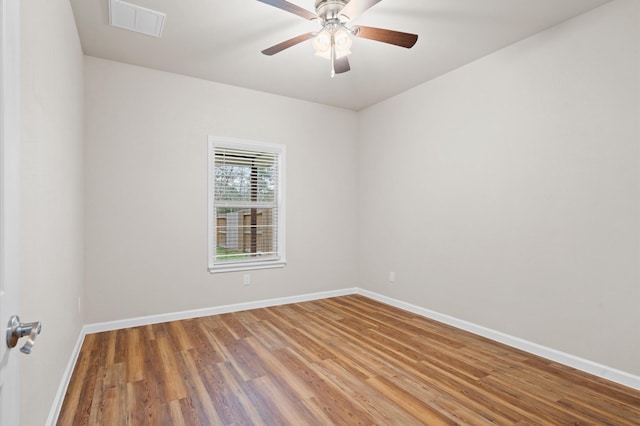 spare room with ceiling fan and hardwood / wood-style floors