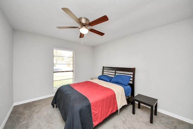 bedroom with ceiling fan and light carpet