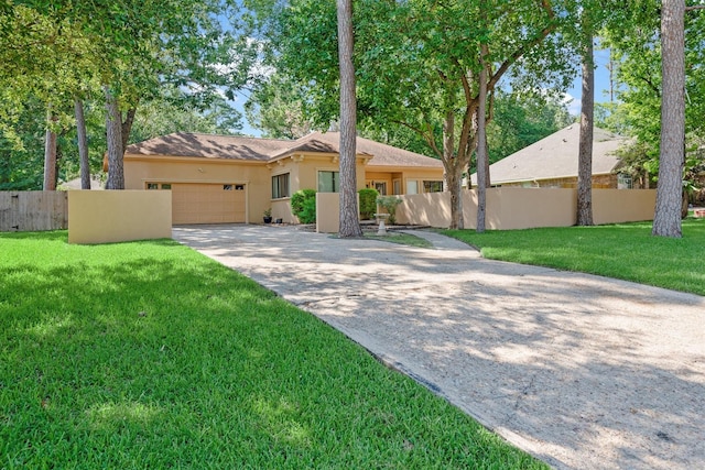 view of front of property with a front lawn and a garage