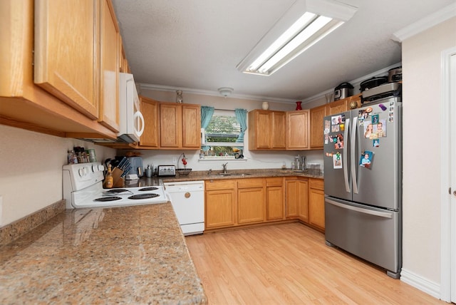 kitchen with white appliances, light wood-type flooring, crown molding, and sink