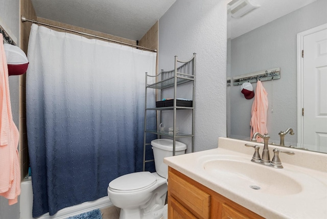 full bathroom with toilet, shower / tub combo, vanity, and a textured ceiling