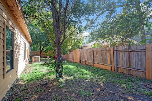 view of yard featuring central air condition unit