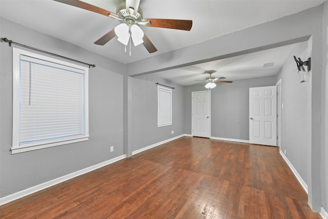 empty room featuring dark wood-type flooring