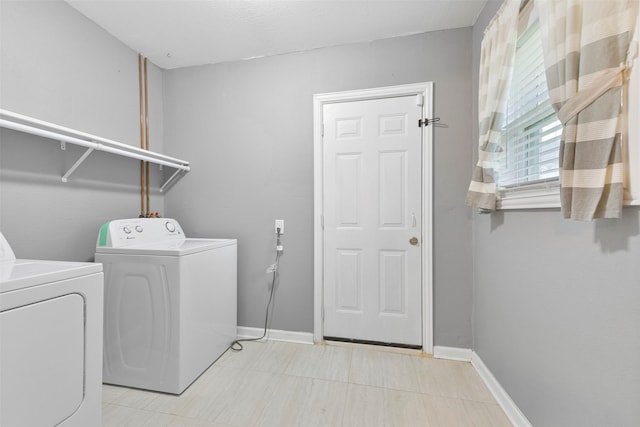 washroom featuring washing machine and clothes dryer