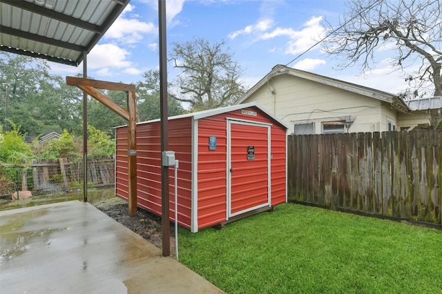 view of outbuilding with a yard