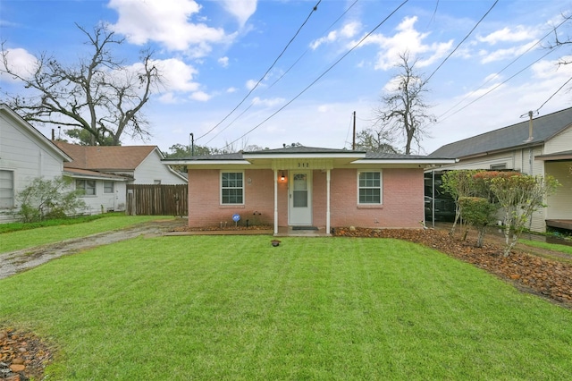 single story home with a front yard