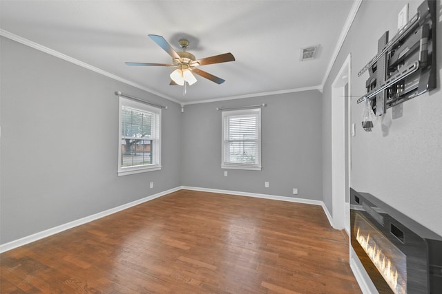 unfurnished room with ornamental molding, ceiling fan, and hardwood / wood-style flooring