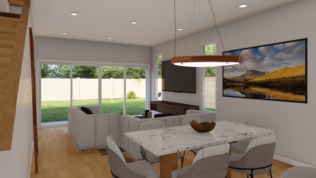 dining space featuring light wood-type flooring