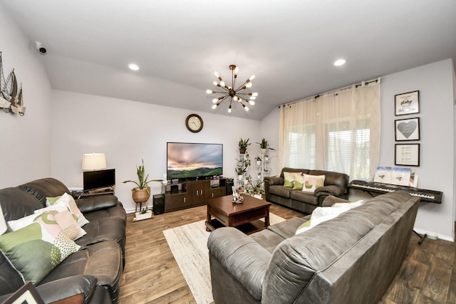 living room featuring a chandelier and hardwood / wood-style flooring