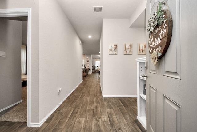 hallway featuring dark wood-type flooring