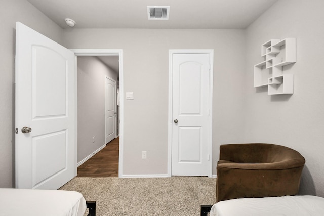 bedroom featuring dark carpet