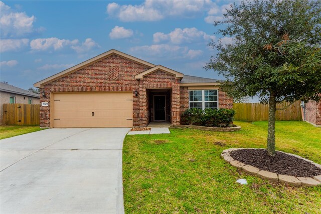 view of front of home with a front lawn and a garage