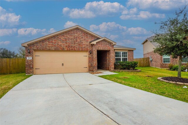 view of front facade featuring a front yard and a garage