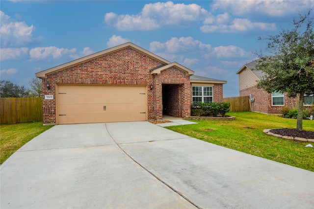 view of front of home featuring a garage and a front lawn