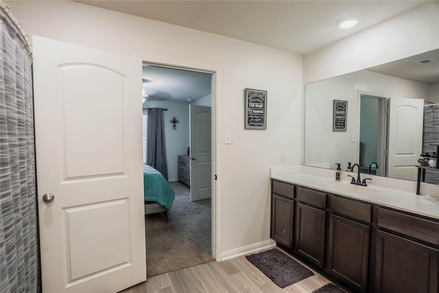 bathroom with wood-type flooring and vanity