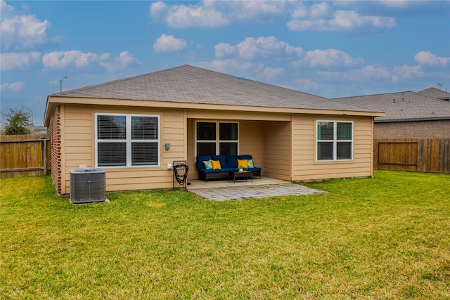 back of house with a patio area, cooling unit, a yard, and an outdoor living space