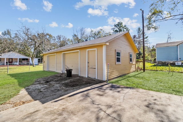 garage with a yard